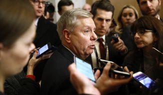 Sen. Lindsey Graham, R-S.C., speaks with reporters as he departs at the end of the day in the impeachment trial of President Donald Trump on charges of abuse of power and obstruction of Congress on Capitol Hill in Washington, Wednesday, Jan. 29, 2020. (AP Photo/Patrick Semansky)