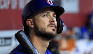 FILE - In this Aug. 10, 2019, file photo, Chicago Cubs&#39; Kris Bryant (17) sits in the dugout during a baseball game against the Cincinnati Reds in Cincinnati. The All-Star third baseman has lost his service-time grievance against the Cubs, two people with direct knowledge of the situation told The Associated Press on Wednesday, Jan. 29, 2020. (AP Photo/Aaron Doster, FIle)
