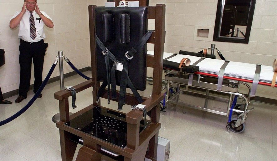FILE - In this Oct. 13, 1999, file photo, Ricky Bell, then the warden at Riverbend Maximum Security Institution in Nashville, Tenn., gives a tour of the prison's execution chamber. A federal court filing by an attorney for Tennessee death row inmates shows that email records from the state Department of Correction raise questions about access to certain execution drugs. A filing on Tuesday, Jan. 29, 2020 notes that a Nov. 21 email says the department was having a difficult time sourcing vecuronium bromide, a paralyzing agent and the second in Tennessee's three-drug lethal injection. The filing says it doesn't appear the department has procured that drug or another paralytic. An Oct. 30 email says there may be a “loop hole” to getting another drug previously used by Tennessee on its own, pentobarbital, by importing it. (AP Photo/Mark Humphrey, File)