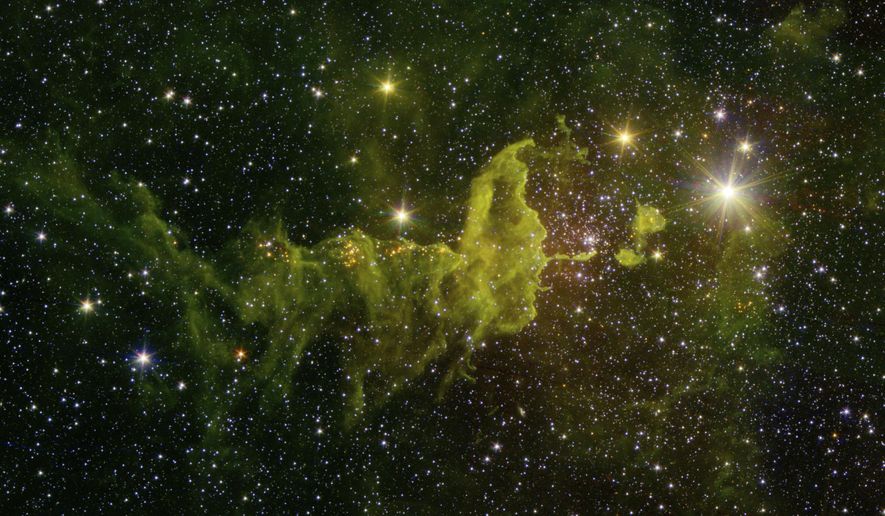 This composite image made available by NASA shows the spider part of "The Spider and the Fly" nebulae, IC 417, where many stars are formed, captured in infrared by the Spitzer Space Telescope and the Two Micron All Sky Survey (2MASS). Located in the constellation Auriga, it is about 10,000 light-years away from Earth in the outer part of the Milky Way, almost exactly in the opposite direction from the galactic center. A team of astronomers has made an intriguing discovery by searching through recent astronomical survey data, identifying seven candidates for alien megastructures, specifically Dyson spheres, that warrant further analysis. (NASA/JPL-Caltech via AP)