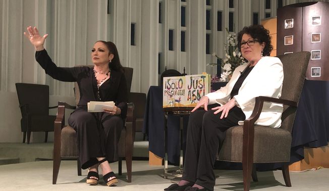 In this Tuesday, Jan. 28, 2020 photo, Singer Gloria Estefan moderates a presentation with Supreme Court Justice Sonia Sotomayor in Miami. Sotomayor spoke to a crowd about her new book &amp;quot;Just Ask&amp;quot;. The new illustrated book teaches children and parents how to be better citizens by explaining that acts of civic participation turn people into heroes. (AP Photo/Adriana Gomez Licon)