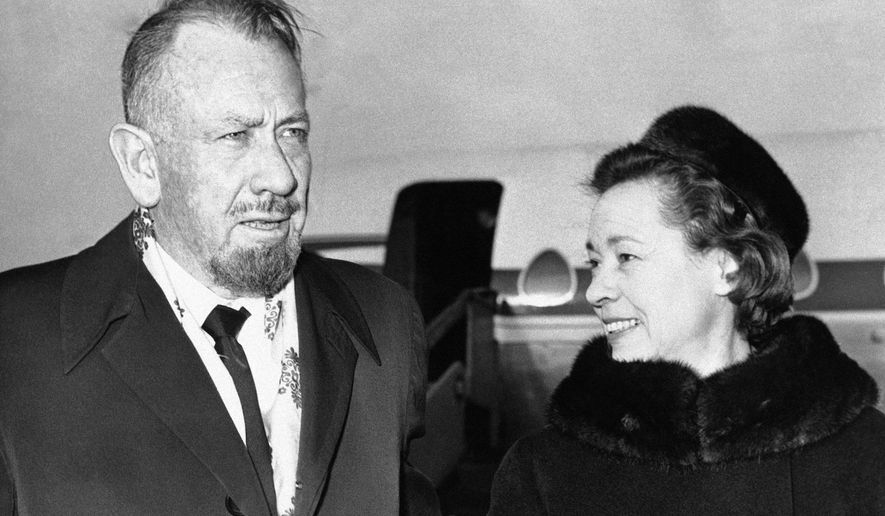 FILE - In this Dec. 13, 1962, file photo, author John Steinbeck, with his wife Elaine arrive at London Airport. Curated Estates in Lincoln Park, N.J. is offering Steinbeck items for auction, including dozens of letters that Elaine wrote from their world travels.  The items will be sold on Feb. 27. (AP Photo/File)