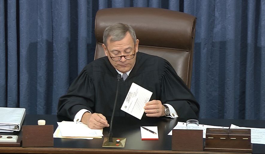In this image from video, presiding officer Chief Justice of the United States John Roberts reads a question during the impeachment trial against President Donald Trump in the Senate at the U.S. Capitol in Washington, Thursday, Jan. 30 2020. (Senate Television via AP)