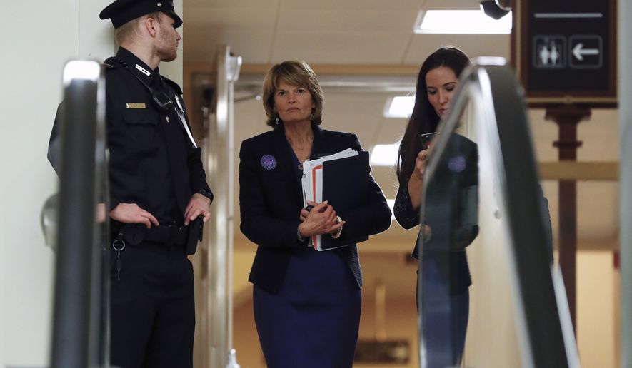 Sen. Lisa Murkowski, R-Alaska, walks in the basement of the U.S. Capitol in Washington, Thursday, Jan. 30, 2020, while leaving at the end of a session in the impeachment trial of President Donald Trump on charges of abuse of power and obstruction of Congress. (AP Photo/Julio Cortez) **FILE**