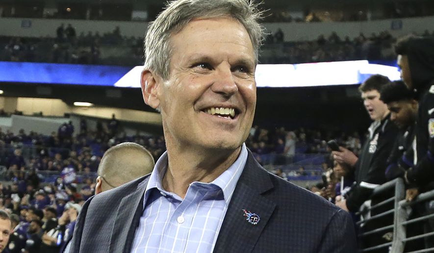FILE - In this Jan. 11, 2020, file photo, Gov. Bill Lee, R-Tenn., walks on the turf before a NFL divisional playoff football game in Baltimore. Lee's office sought to downplay potential consequences over an anti-LGBT adoption proposal, multiple big companies reached out to his administration warning the state's reputation would suffer if the Republican were to enact it. Emails obtained through a public records request by The Associated Press show representatives from IKEA, Mars Inc., Nestle USA, Unilever and Danone North America all reached out to Lee's office raising concerns about the proposal's effect on recruiting and retaining employees. (AP Photo/Julio Cortez, File)