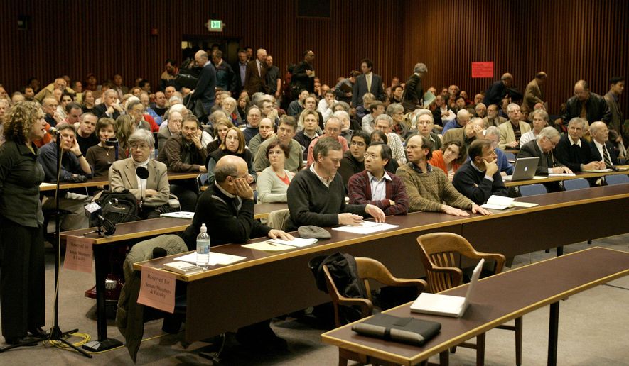 FILE - In this April 19, 2007, file photo, attendees fill the auditorium in Boalt Hall for a debate on the University of California, Berkeley campus in Berkeley, Calif. U.C. Berkeley's prestigious law school has stripped itself of a 19th century namesake who espoused racist views that led to the 1882 Chinese Exclusion Act. John Boalt's name was removed from a main building Thursday, Jan. 30, 2020, after a three-year process. The name removal comes as institutions around the country re-assess the people honored with their monuments, streets and buildings. (AP Photo/Ben Margot, File)