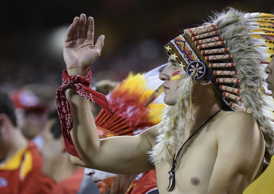 FILE - In this Oct. 2, 2017, file photo, a Kansas City Chiefs fan does the "tomahawk chop" during the second half of an NFL football game in Kansas City, Mo. While other sports teams using Native American nicknames and imagery have faced decades of protests and boycotts, the Chiefs have largely slid under the radar. Vincent Schilling, associate editor of Indian Country Today, said it's time for the Chiefs to face the music. "When I see something like a tomahawk chop, which is derived from television and film portrayals, I find it incredibly offensive because it is an absolutely horrible stereotype of what a native person is." (AP Photo/Reed Hoffmann, File)