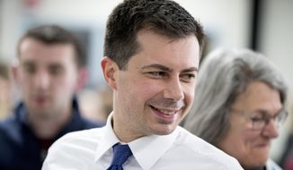Democratic presidential candidate former South Bend, Ind., Mayor Pete Buttigieg greats members of the audience at a campaign stop at Chickasaw Event Center, Wednesday, Jan. 29, 2020, in New Hampton, Iowa. (AP Photo/Andrew Harnik)