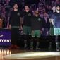 Boston Celtics players look top at a video tribute to the late Los Angeles Laker Kobe Bryant, before an NBA basketball game against the Golden State Warriors, Thursday, Jan. 30, 2020, in Boston. (AP Photo/Elise Amendola)