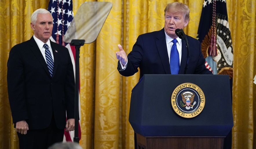 President Donald Trump speaks during an event on human trafficking in the East Room of the White House, Friday, Jan. 31, 2020, in Washington, as Vice President Mike Pence looks on.  (AP Photo/ Evan Vucci)