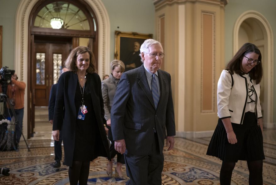 Senate Majority Leader Mitch McConnell, R-Ky., leaves the chamber during the impeachment trial of President Donald Trump on charges of abuse of power and obstruction of Congress, at the Capitol in Washington, Friday, Jan. 31, 2020. (AP Photo/J. Scott Applewhite)