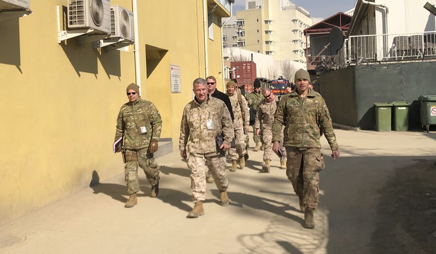 Marine Gen. Frank McKenzie, center, top U.S. commander for the Middle East, makes an unannounced visit, Friday, Jan. 31, 2020 in Kabul, Afghanistan. (AP Photos/Lolita Baldor)