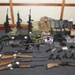 FILE - This undated file image provided by the Maryland U.S. District Attorney&#39;s Office shows a photo of firearms and ammunition that was in the motion for detention pending trial in the case against Christopher Hasson.  The Coast Guard lieutenant accused of stockpiling guns and drawing up a hist list of prominent Democrats and TV journalists is scheduled to be sentenced on Friday, Jan. 31, 2020 for his guilty plea to firearms and drug offenses. (Maryland U.S. District Attorney&#39;s Office via AP, File)