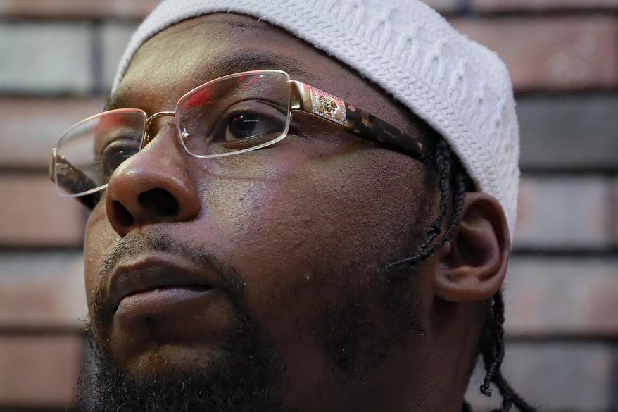 Myon Burrell, convicted in the murder of Tyesha Edwards, an 11-year-old girl pierced in the heart by a stray bullet in 2002 while doing homework at her family's dining room table, is interviewed at the Stillwater Correctional Facility, Wednesday, Oct. 23, 2019, in Stillwater, Minn. Burrell, convicted with no gun, fingerprints or hard evidence implicating him, has drawn a growing number of legal experts, community leaders and civil rights activists who are worried that the black teenager may have been wrongly convicted. (AP Photo/John Minchillo)