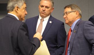 Commissioner of Administration Jay Dardenne, the governor&#39;s chief budget adviser, left; House Speaker Clay Schexnayder, R-Gonzales, center; and Senate President Page Cortez, R-Lafayette, speak ahead of a meeting of Louisiana&#39;s income forecasting panel on Friday, Feb. 7, 2020, in Baton Rouge, La. (AP Photo/Melinda Deslatte)