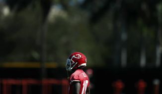 Kansas City Chiefs wide receiver Tyreek Hill (10) looks on during practice, Wednesday, Jan. 29, 2020, in Davie, Fla., for the NFL Super Bowl 54 football game. (AP Photo/Brynn Anderson)