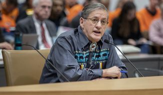 Chief Kenneth Chalmers addressed a group of four PUC commissioners as they took in comments and sentiments directly from the public regarding the controversial Line 3 oil pipeline during a hearing at the Senate Office Building, Friday, Jan. 31, 2020 in St. Paul, Minn.  (Elizabeth Flores/Star Tribune via AP)