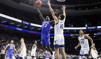 Creighton&#39;s Damien Jefferson (23) goes up for a shot against Villanova&#39;s Cole Swider (10) during the second half of an NCAA college basketball game, Saturday, Feb. 1, 2020, in Philadelphia. (AP Photo/Matt Slocum)