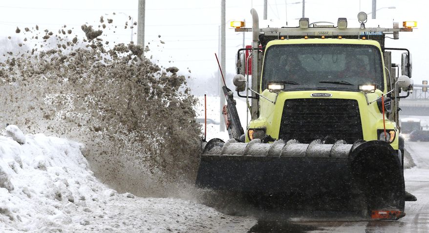 Eau Claire County snow plow driver David Gotlibson plows in Eau Claire, Wis., Monday, Jan. 22, 2020. Gotlibson is one of a few dozen county workers tasked with the sometimes draining, often unpredictable job of salting and plowing state and county roads during winter, the Leader-Telegram reported. (Dan Reiland/The Eau Claire Leader-Telegram via AP)