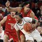 Michigan&#39;s Zavier Simpson (3) drives past Rutgers&#39;s Daniel Lobach (2) during the second half of an NCAA college basketball game Saturday, Feb. 1, 2020, in New York. Michigan won 69-63. (AP Photo/Frank Franklin II)