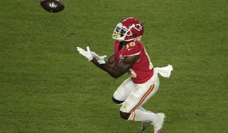 Kansas City Chiefs&#39; Tyreek Hill (10) catches a pass, during the second half of the NFL Super Bowl 54 football game against the San Francisco 49ers, Sunday, Feb. 2, 2020, in Miami Gardens, Fla. (AP Photo/Charlie Riedel)