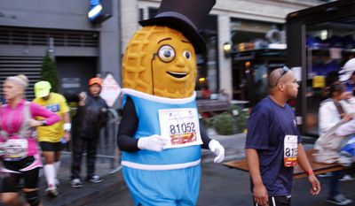 COMMERCIAL IMAGE - In this photograph taken by AP Images for PLANTERS, Mr. Peanut prepares for his first marathon run at the Wipro San Francisco Marathon in San Francisco, Sunday, July 29, 2012.  (Alison Yin/AP Images for PLANTERS)