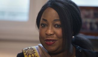 FILE - In this Monday, Feb. 5, 2018 file photo, FIFA Secretary General Fatma Samoura meets with Spain&#39;s Sports Minister Ínigo Mendez de Vigo in Madrid, Spain. FIFA&#39;s six months in control of African soccer appeared to end when Fatma Samoura&#39;s six-month spell in temporary charge of the continent&#39;s governing body was not extended on Sunday Feb. 2, 2020. (AP Photo/Paul White, File)