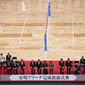 City officials and Olympic organizers pause for photos before cutting the ribbon during a grand opening ceremony of the Ariake Arena, a venue for volleyball at the Tokyo 2020 Olympics and wheelchair basketball during the Paralympic Games, Sunday, Feb. 2, 2020, in Tokyo. (AP Photo/Jae C. Hong)