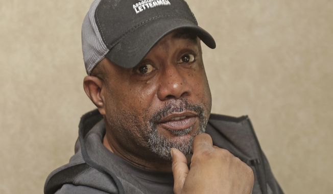 Darius Rucker poses for a photo before taking the stage. Sunday, Feb. 2, 2020 in Miami. Rucker and his band played the On Location Experiences&#x27; pregame tailgate party before Super Bowl LIV. (AP Photo/John Carucci)