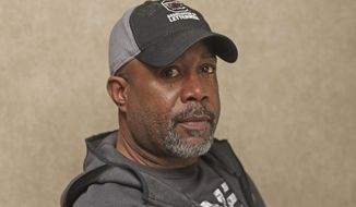 Darius Rucker poses for a photo before taking the stage. Sunday, Feb. 2, 2020 in Miami. Rucker and his band played the On Location Experiences&#39; pregame tailgate party before Super Bowl LIV. (AP Photo/John Carucci)