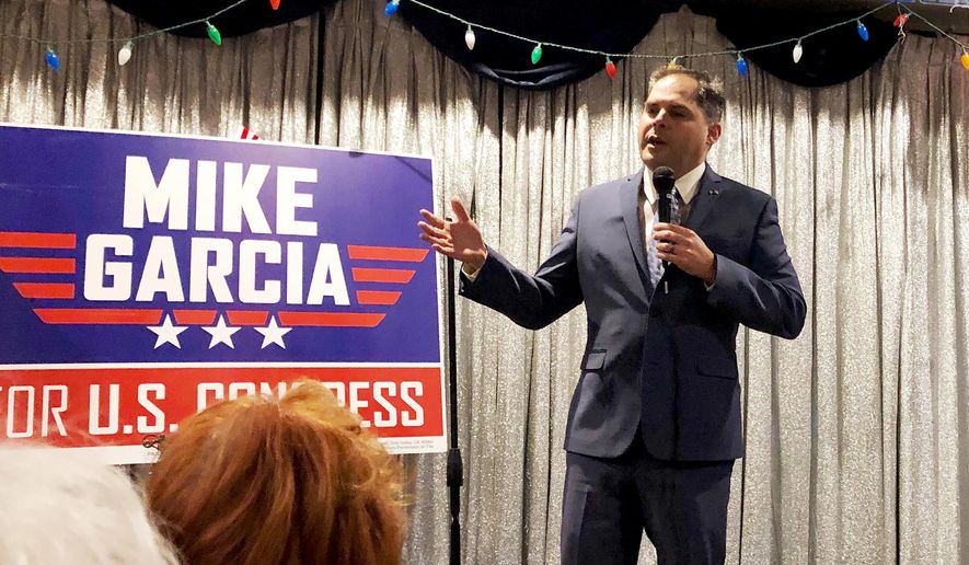 In this Tuesday, Jan. 28, 2020, photo, 25th Congressional District candidate and former Navy combat pilot Mike Garcia addresses supporters in Simi Valley, Calif. (AP Photo/Michael Blood) ** FILE **