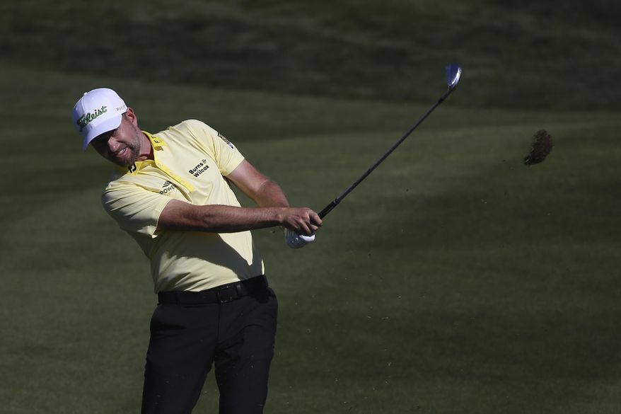 Webb Simpson hits from the second fairway during the final round of the Waste Management Phoenix Open PGA Tour golf event Sunday, Feb. 2, 2020, in Scottsdale, Ariz. (AP Photo/Ross D. Franklin)