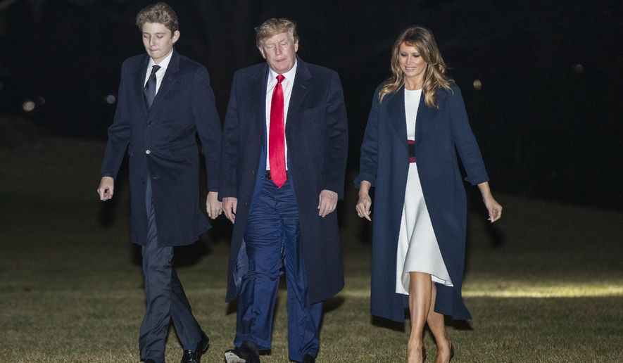 President Donald Trump together with first lady Melania Trump and their son Barron Trump, arrive at the White House, Sunday, Feb. 2, 2020, in Washington from a weekend trip at his Mar-a-Lago estate in Palm Beach, Fla. (AP Photo/Manuel Balce Ceneta)
