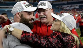 Kansas City Chiefs head coach Andy Reid, center, celebrates with wife Tammy, right, and Anthony Sherman after the NFL Super Bowl 54 football game against the San Francisco 49ers, Sunday, Feb. 2, 2020, in Miami Gardens, Fla. The Kansas City Chiefs won 31-20. (AP Photo/Patrick Semansky)
