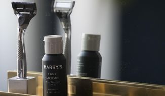 FILE - In this June 15, 2018, file photo, the Winston razor and Harry&#39;s face lotion are on display at the headquarters of Harry&#39;s Inc., in New York. Federal antitrust regulators say a proposed merger that would combine old-school shaving company Schick with upstart Harry&#39;s would end up costing consumers some skin. (AP Photo/Mary Altaffer, File)