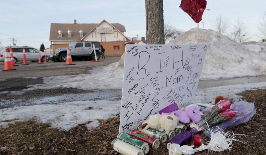 A makeshift memorial is seen on Sunday, Feb. 2, 2020, outside Gene's Supper Club, 4323 N. 60th St. near the scene where a pregnant woman died early Saturday around 2:30 a.m. following a drive-by shooting in. Her infant child is alive and in stable condition, after doctors at St. Joseph Hospital performed an emergency C-section, police said. According to police, the mother was a passenger in a party bus that was parked when a gunman fired five to six rounds from the sunroof of a passing car. (Mike De Sisti/Milwaukee Journal Sentinel via AP)