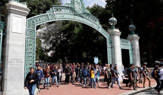 In this Aug. 15, 2017, file photo, students walk on the University of California, Berkeley campus in Berkeley, Calif. (AP Photo/Marcio Jose Sanchez, File)