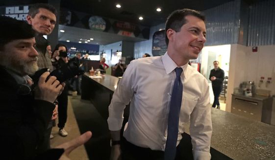 Democratic presidential candidate former South Bend Mayor Pete Buttigieg arrives at Community Oven Pizza for a campaign event, Tuesday, Feb. 4, 2020, in Hampton, N.H. (AP Photo/Elise Amendola)