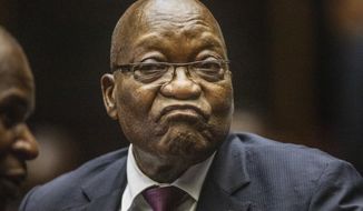 In this Oct. 15, 2019, file photo, former South African President Jacob Zuma appears in the High Court in Pietermaritzburg, South Africa.  The South African Broadcasting Corporation reports that an arrest warrant was issued for former president Jacob Zuma by a judge in South Africa Tuesday, Feb. 4, 2020, for failing to appear at court in a corruption case. (Michele Spatari/Pool via AP, File)