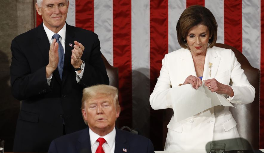 House Speaker Nancy Pelosi of Calif., tears her copy of President Donald Trump&#39;s s State of the Union address after he delivered it to a joint session of Congress on Capitol Hill in Washington, Tuesday, Feb. 4, 2020. Vice President Mike Pence is at left. (AP Photo/Patrick Semansky)