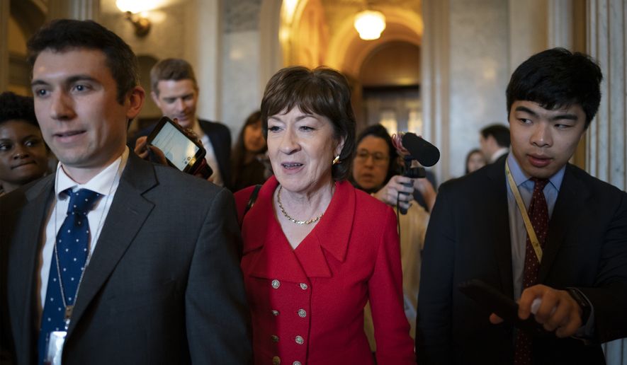 Sen. Susan Collins, R-Maine, center, departs as Republican senators leave a closed-door strategy session at the Capitol in Washington, Tuesday, Feb. 4, 2020. They are expected to acquit President Donald Trump tomorrow on impeachment charges of abuse of power and obstruction of Congress. (AP Photo/J. Scott Applewhite)