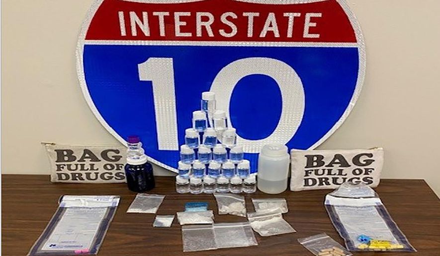 In this photo made available by the Florida Highway patrol shows confiscated drugs following the arrest of two men Tuesday, Feb. 4, 2020, Santa Rosa County, Fla. Authorities confiscated methamphetamine, cocaine and fentanyl. (Florida Highway Patrol via AP)