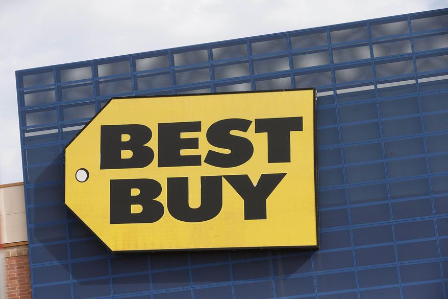 FILE - In this Aug. 27, 2019, file photo, the Best Buy logo is shown on a store in Richfield, Minn. Best Buy said Tuesday, Feb. 4, 2020, that CEO Corie Barry will continue to lead the company after its board completed an investigation into allegations against her in an anonymous letter. (AP Photo/Jim Mone, File)