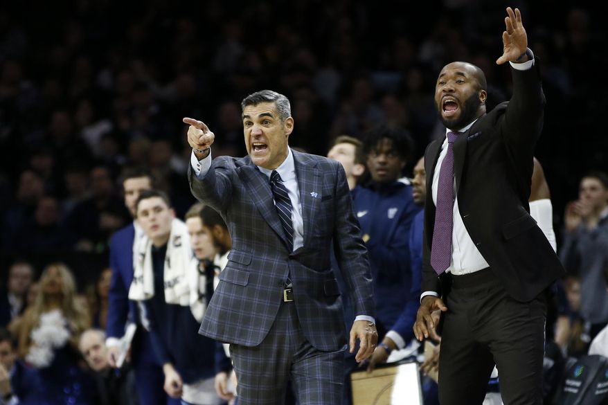 Villanova head coach Jay Wright, left, and assistant coach Kyle Neptune yell to their team during the second half of an NCAA college basketball game against Creighton, Saturday, Feb. 1, 2020, in Philadelphia. (AP Photo/Matt Slocum)
