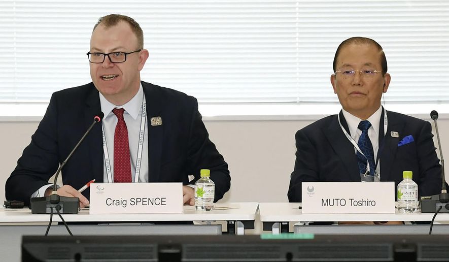 Chief Executive Officer Toshiro Muto, right, and Craig Spence, head of communications of the International Paralympic Committee, attend a news conference in Tokyo Wednesday, Feb. 5, 2020. Tokyo Olympic organizers said Wednesday they are increasingly concerned about the disruption the fast-spreading virus in China is causing with the games opening in just under six months. “I am seriously worried that the spread of the infectious disease could throw cold water on the momentum toward the games," Muto said. “I hope that it will be stamped out as soon as possible.” (Kyodo News via AP)