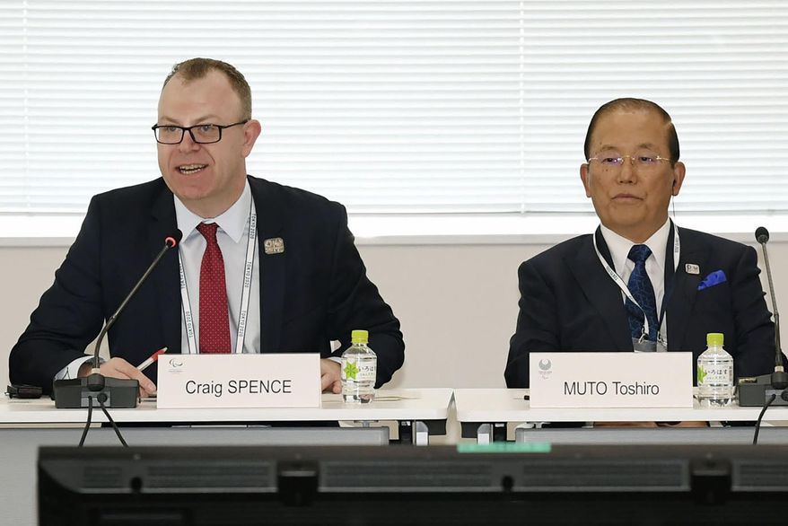 Chief Executive Officer Toshiro Muto, right, and Craig Spence, head of communications of the International Paralympic Committee, attend a news conference in Tokyo Wednesday, Feb. 5, 2020. Tokyo Olympic organizers said Wednesday they are increasingly concerned about the disruption the fast-spreading virus in China is causing with the games opening in just under six months. “I am seriously worried that the spread of the infectious disease could throw cold water on the momentum toward the games," Muto said. “I hope that it will be stamped out as soon as possible.” (Kyodo News via AP)