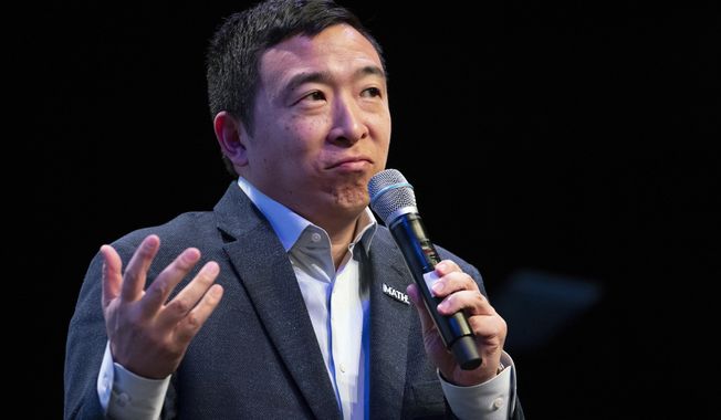 Andrew Yang pauses as he speaks during the New Hampshire Youth Climate and Clean Energy Town Hall, Wednesday, Feb. 5, 2020, in Concord, N.H. (AP Photo/Mary Altaffer)