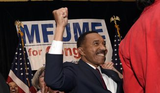Kweisi Mfume, Democratic nominee for Maryland&#39;s 7th Congressional District, raises his fist at a victory party, Tuesday, Feb. 4, 2020, in Baltimore. (AP Photo/Gail Burton)