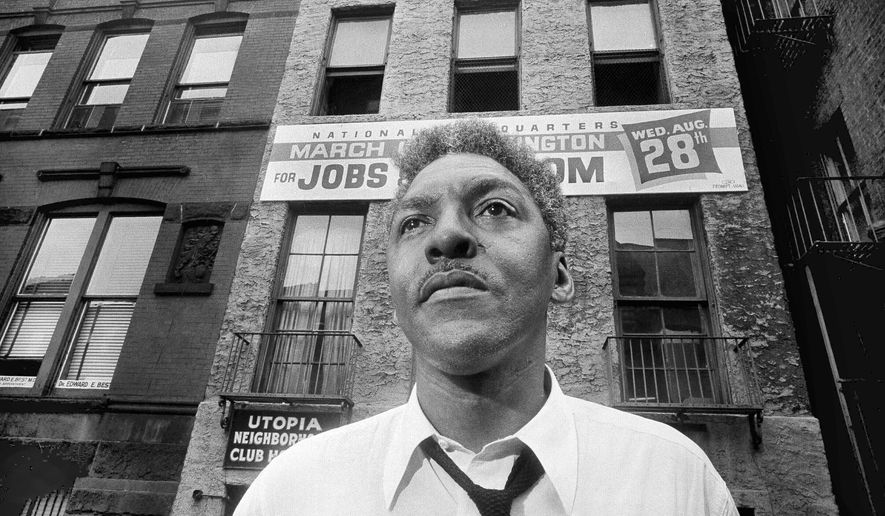In this Aug. 1, 1963, file photo, Bayard Rustin, leader of the March on Washington poses in New York City. California's governor announced Wednesday, Feb. 5, 2020, that he is posthumously pardoning Rustin, a gay civil rights leader, while creating a new pardon process for others convicted under outdated laws punishing homosexual activity. (AP Photo/Eddie Adams, File)