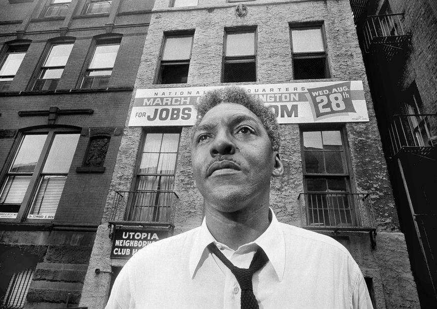 In this Aug. 1, 1963, file photo, Bayard Rustin, leader of the March on Washington poses in New York City. California's governor announced Wednesday, Feb. 5, 2020, that he is posthumously pardoning Rustin, a gay civil rights leader, while creating a new pardon process for others convicted under outdated laws punishing homosexual activity. (AP Photo/Eddie Adams, File)